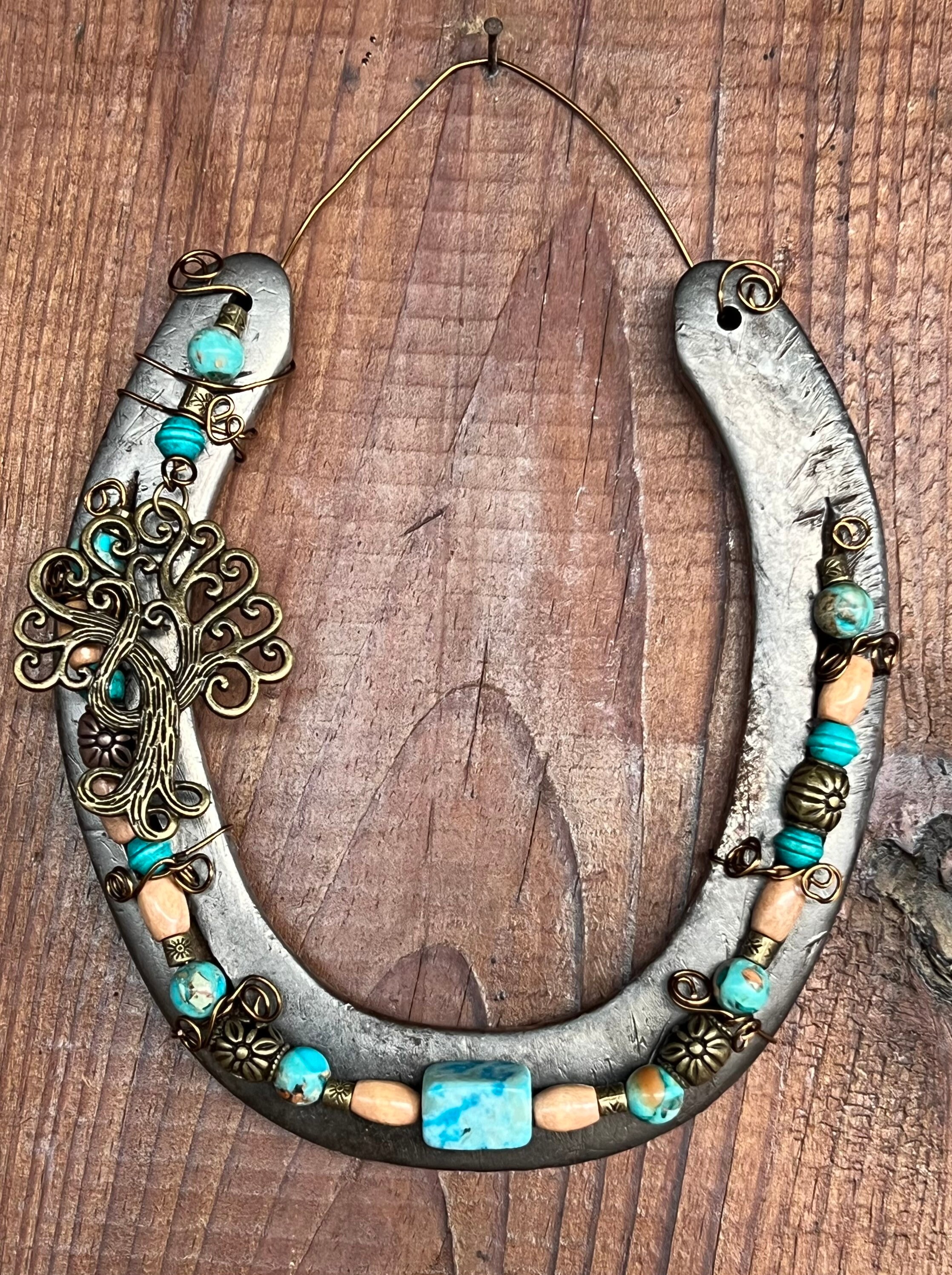 Hand Decorated horseshoe wall hanging. Upcycled, green glass bead