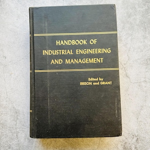 May include: A black hardback book titled Handbook of Industrial Engineering and Management, edited by Ireson and Grant. The front cover features gold lettering and two horizontal gold lines above and below the main title text.
