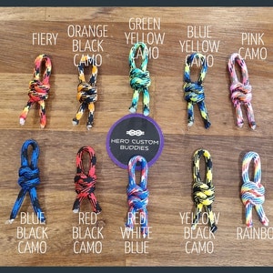 May include: Ten different color combinations of paracord dog toys. The toys are made with a knot that resembles a figure eight. The colors include fiery, orange black camo, green yellow camo, blue yellow camo, pink camo, blue black camo, red black camo, red white blue, yellow black camo, and rainbow.