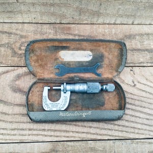 May include: A rustic wooden sign with the text "Welcome to our home" in white lettering. The sign features a distressed finish and a simple, inviting design, perfect for entryway decor.