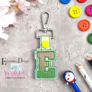Embroidery fonts contain E monogram embroidery designs for making key fob embroidery. This is ITH embroidery designs ideal for ith snap tab.