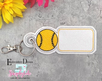 May include: A white softball keychain with a yellow softball and a blank white rectangle for personalization. The keychain has a silver metal ring and a silver metal clasp.