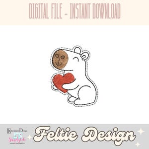 May include: A white felt animal with brown ears holding a red heart. The animal is smiling and has a stitched outline. The image is labeled "Feltie Design".