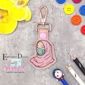Girl wearing Face Mask Snap Tab , Embroidery Digital File Instant Download key fob, machine embroidery design, in the hoop