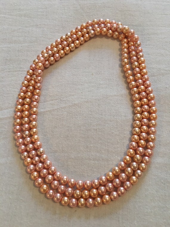 Mother-of-pearl pink pearls in mother-of-pearl / G