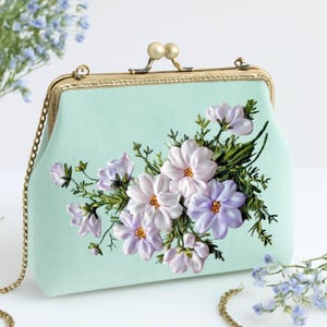 Handmade linen clutch with 3D lilac ribbon embroidery – elegant gift for weddings, tea parties & romantic souls.