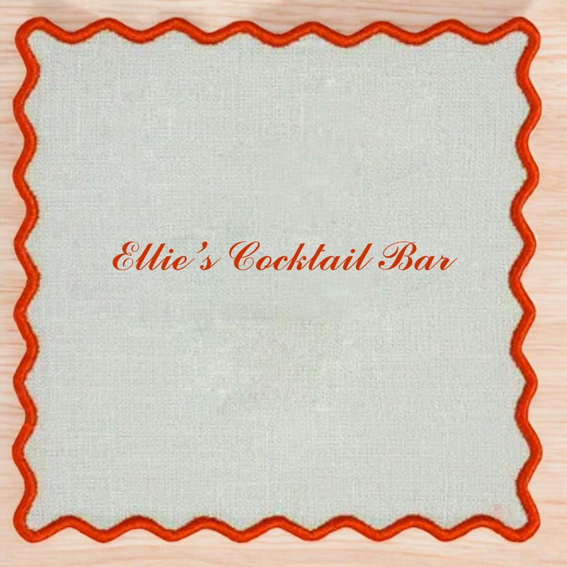 May include: A white square coaster with a red scalloped border. The text "Ellie's Cocktail Bar" is printed in red on the coaster.
