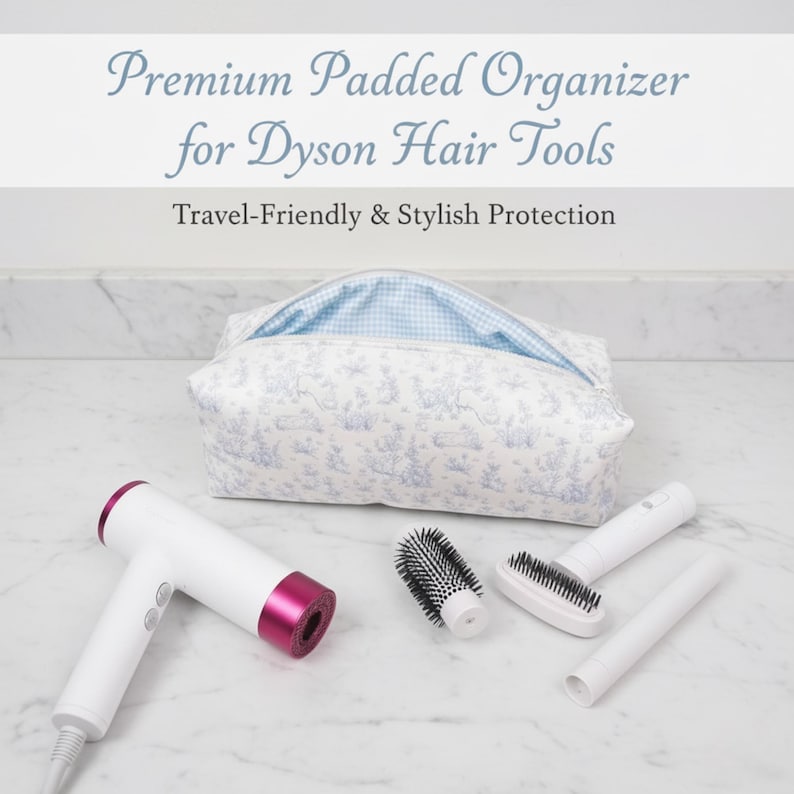 May include: A white and pink Dyson hair dryer and accessories are displayed with a patterned organizer bag. The bag is white with a blue toile print and a blue gingham interior. The text reads "Premium Padded Organizer for Dyson Hair Tools".