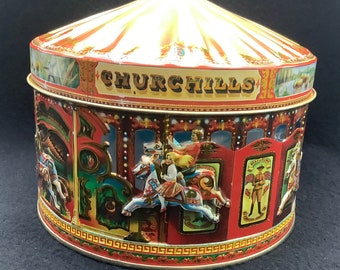 A vintage Collectible Embossed Churchill's Carousel Cookie Tin, Based on the well-known fairground ride