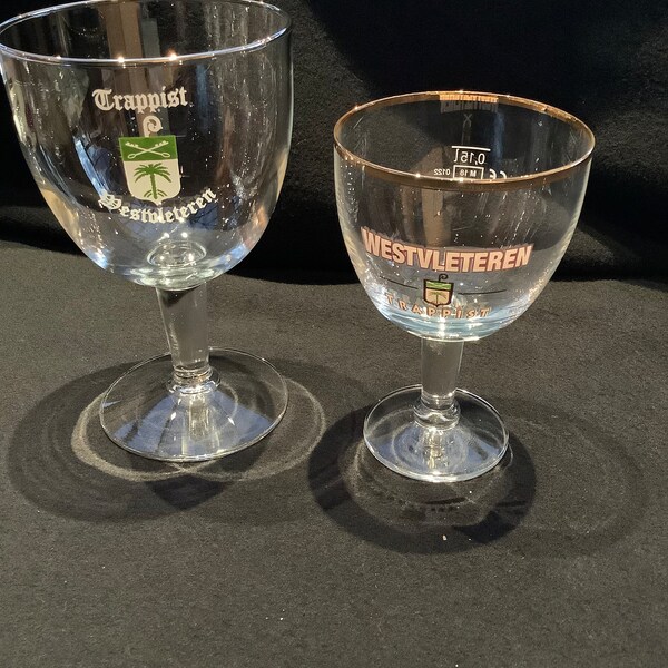 2 different Westvleteren glasses. A 15cl tasting glass with gold rim, and a unique old design glass 33cl