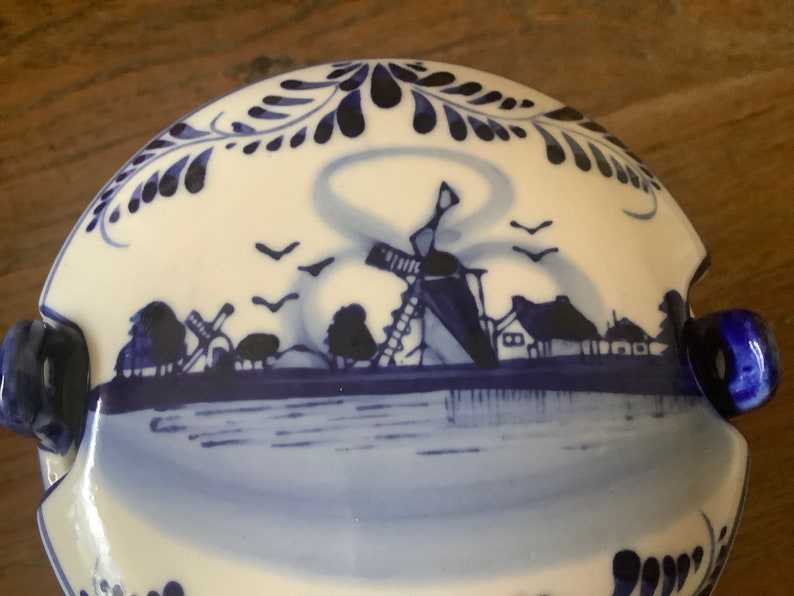 Beautiful vintage round blue delfts glazed ceramic barrel butter dish with lid decorated with a hand painted blue dutch scene image 10
