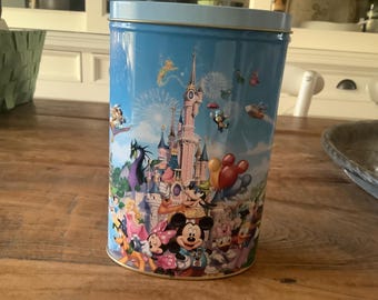disney paris tin with the image of historical cartoon characters.