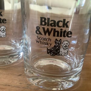 2 vintage Buchanans black and white scotch whisky shot glass, with the two black and white terrier dogs Scottie and Westie