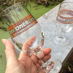 2 collector stemmed beer glasses, Omer tasting glasses 25cl, 8.45oz,  from brewery Vander Ghinste Belgium, letters in enamel on the glasses