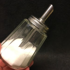 A vintage retro sugar dispenser/shaker and honey or creamer dispenser Design, made by BMF