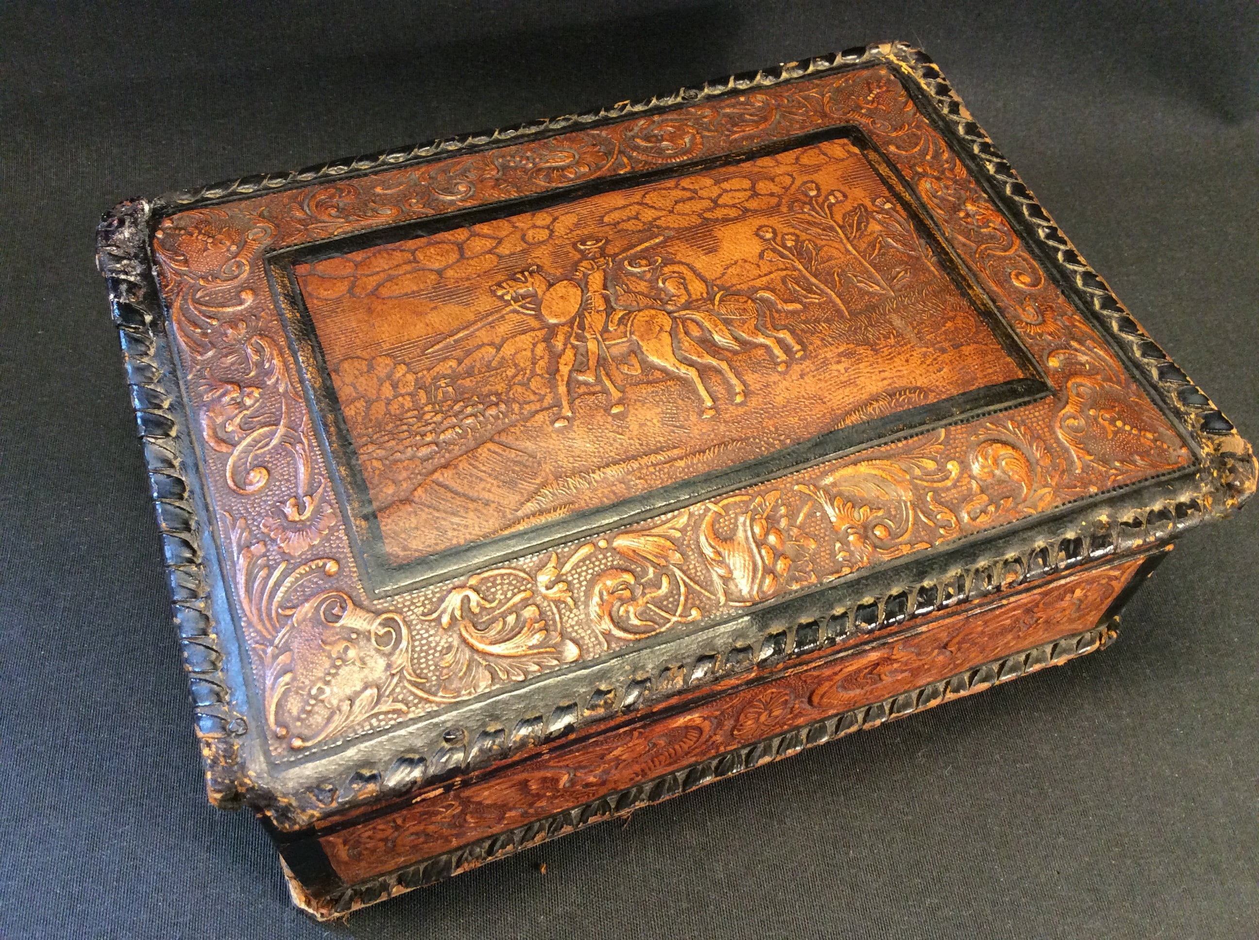 A  vintage Don Quijote, Quixote, quichote  de la Mancha cigarette, cigar case, covered with  embossed faux leather, made in Spain