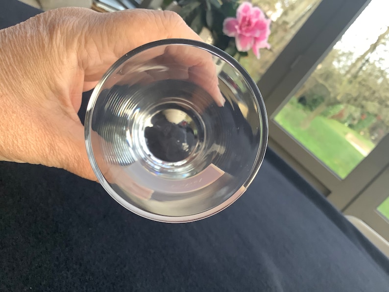 May include: The bottom of a clear glass goblet with a fluted design.
