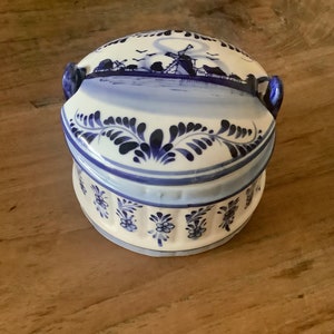 Beautiful vintage round blue delfts glazed ceramic barrel butter dish with lid decorated with a hand painted blue dutch scene image 1