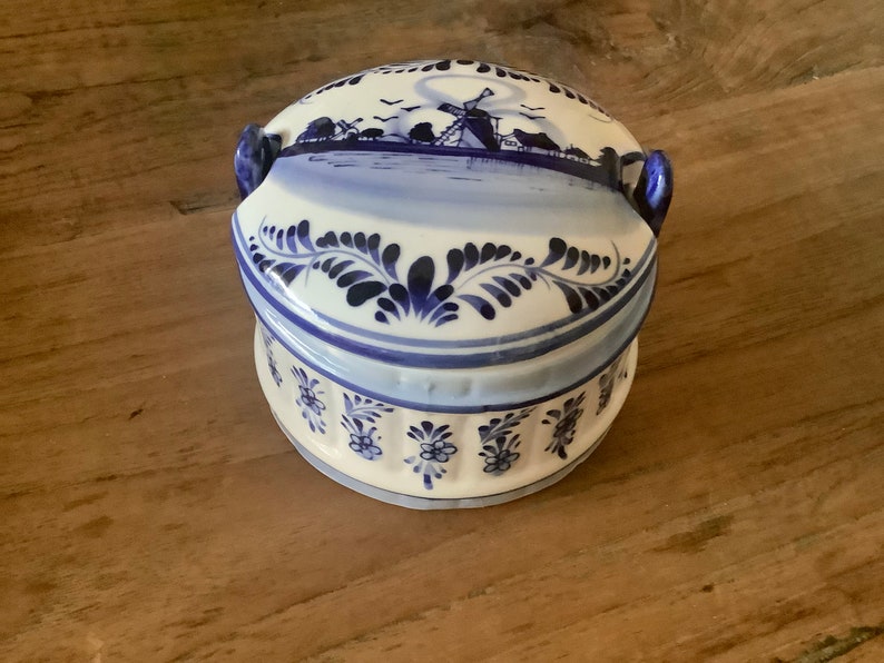 Beautiful vintage round blue delfts glazed ceramic barrel butter dish with lid decorated with a hand painted blue dutch scene image 1