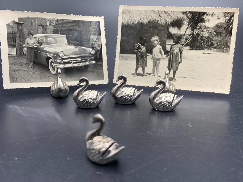 6 vintage name card or photo holders in the shape of metal little swans for a placeholder