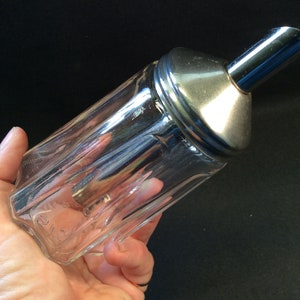 A vintage sugar dispenser / shaker and honey of creamer dispenser set Design, by Stoha, Germany