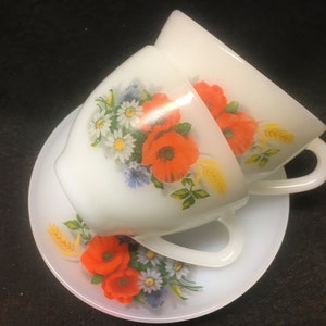 2 vintage arcopal tea or coffee cups with saucers with an image of poppies and wild flowers