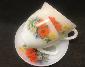 2 vintage arcopal tea or coffee cups with saucers with an image of poppies and wild flowers