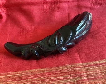 Black mask carved from horn.