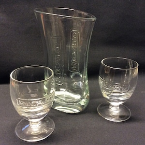 A glass ricard carafe Pastis with two matching ricard glasses. this carafe was released in 2012, designed by Eric Barthés.