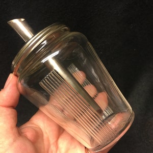 A vintage sugar dispenser/shaker and honey or creamer dispenser set Design, from corn Drost, Rhenen Holland