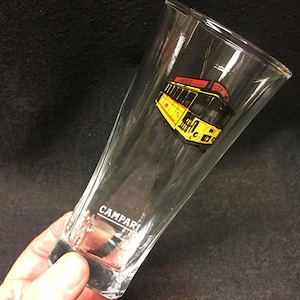 a Vintage Campari longdrink glass with image of Campari trolley car and  with white inscription Campari advertisement