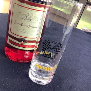 A Vintage Campari longdrink glass with inscription of the 24h race of Francorchamps, and  with yellow inscription Campari advertisement