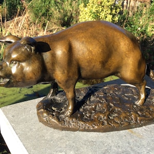 Beautiful antique Victorian bronze statue of a pig, with one leg tied to a post.