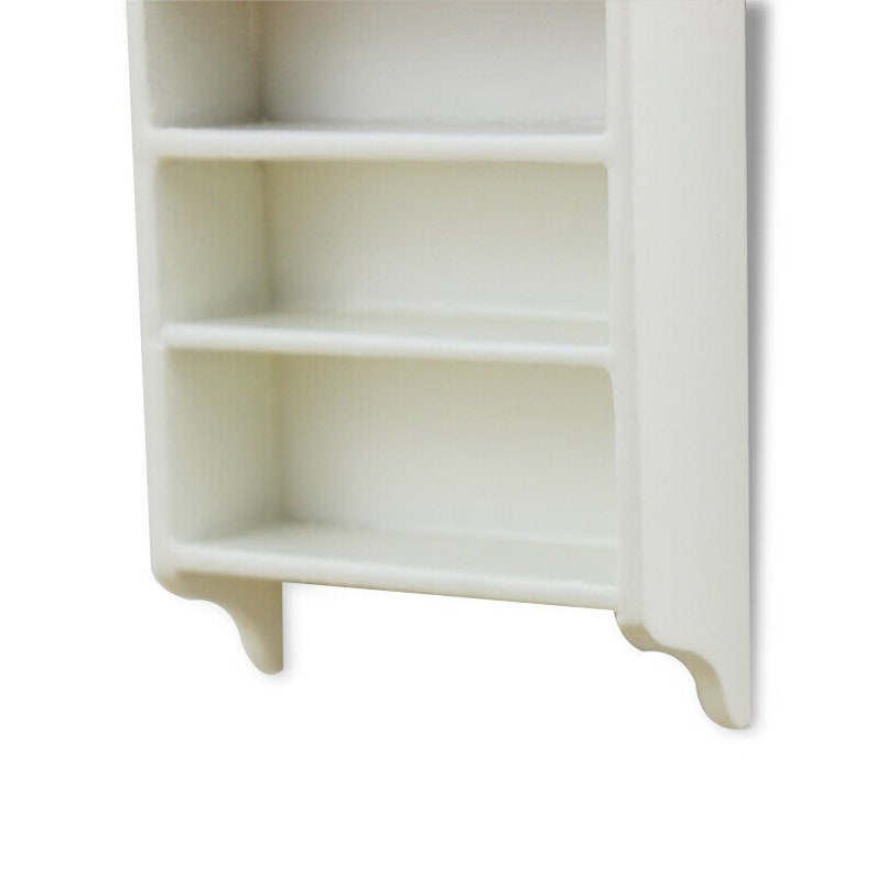 May include: White wall-mounted shelf with three shelves. The shelf has a simple design with a slightly curved bottom edge.