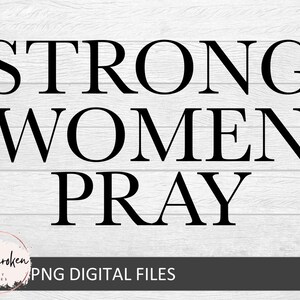 May include: Black text on a white wood background reads "Strong Women Pray".