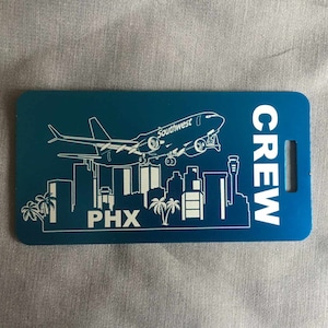 2 - SWA Crew bag tags made from anodized aluminum customized with crew base skyline.  Optional Name and