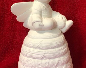 Ceramic Bee Baby sitting on a Honeycomb in bisque ready to paint