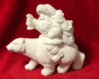 Santa Riding a Polar Bear in ceramic bisque ready to paint