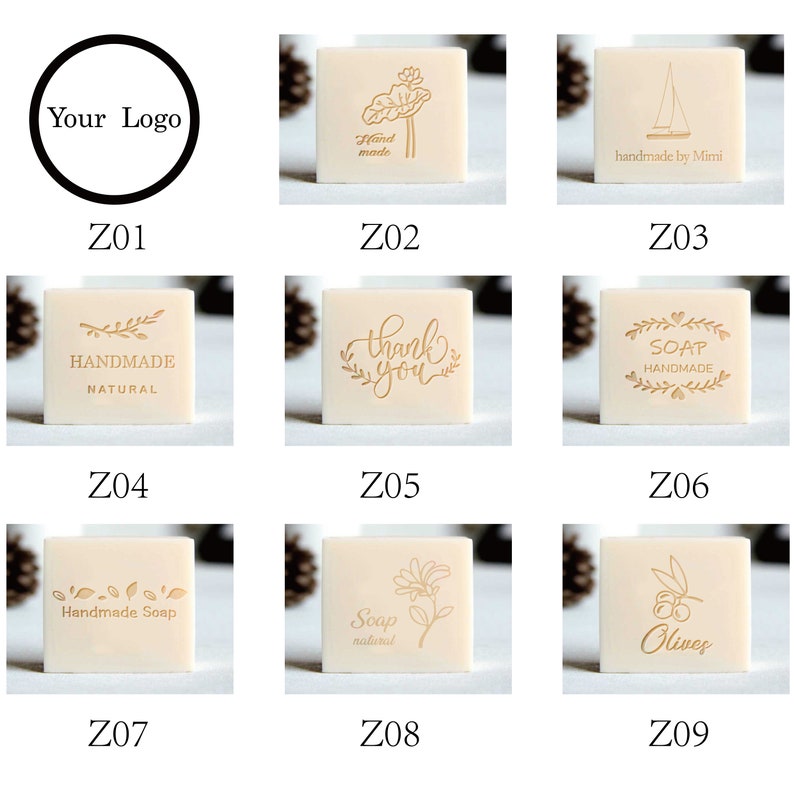 May include: Nine different designs for square soap stamps. The stamps are made of wood and have a light brown color. The designs include a lotus flower, a sailboat, a branch with leaves, the words "thank you", a wreath with hearts and the word "soap", a branch with leaves and the words "handmade soap", a flower, a branch with olives and the word "olives", and a circle with the words "Your Logo".