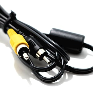 May include: A black AV cable with yellow, black, and silver connectors. The cable is bundled and secured with a black fastener. The connectors include a yellow RCA connector and two black RCA connectors.