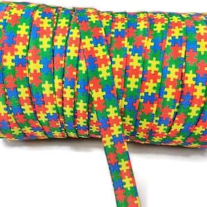 3+ Yards Puzzle Piece Autism Fold Over Elastic - Stretchy- great for crafts or making hair ties! Custom Print - blue, red, green, yellow