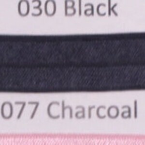 May include: Two fabric swatches, one black and one charcoal gray, with corresponding numbers and color names. The swatches are labeled "030 Black" and "077 Charcoal".