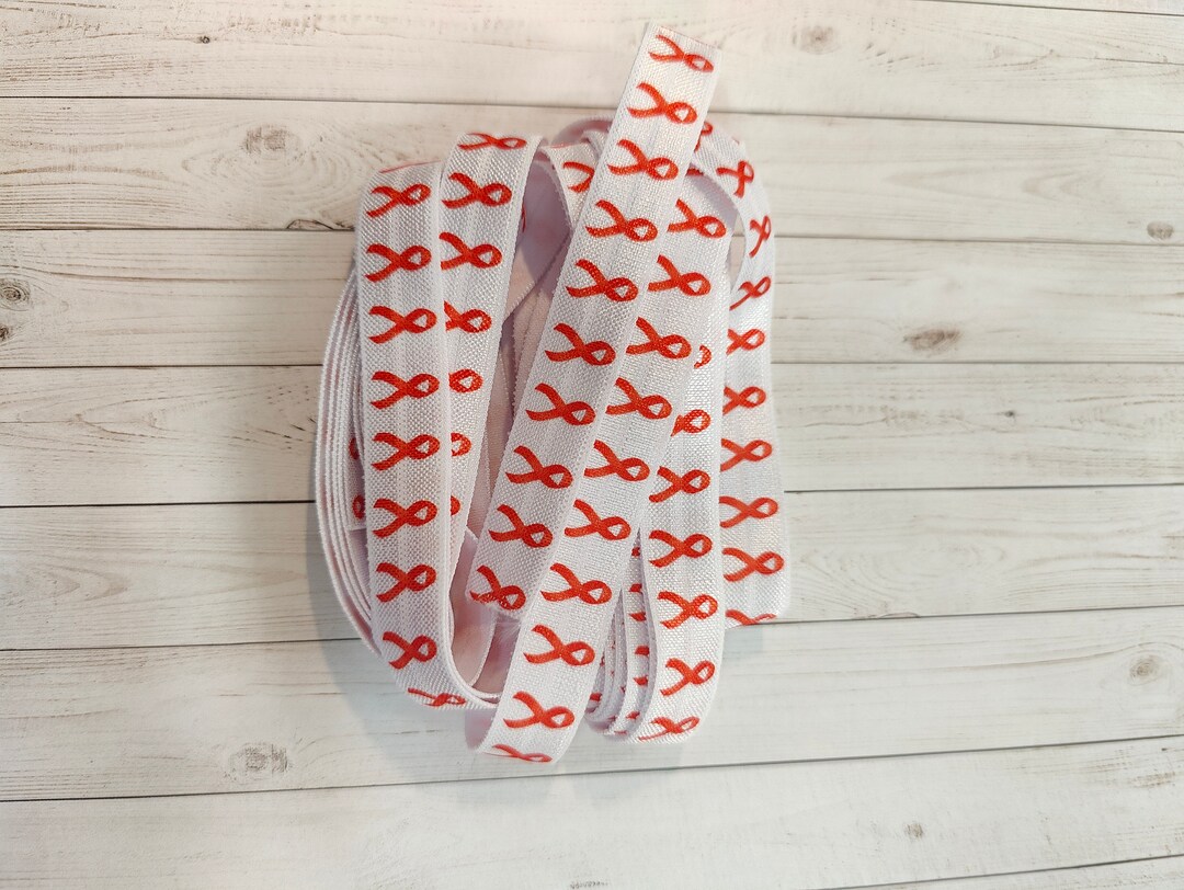 Clearance Returned Item Reduced Pricing Ready to Ship. 5 Yards White Elastic With Orange