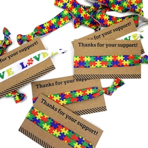 Concientización sobre el autismo Gracias por su apoyo -Tarjeta con banda elástica, brazalete, pulsera, cintas para el cabello - Piezas de rompecabezas - Ideal para regalos o recaudación de fondos