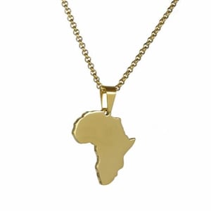 May include: A gold-coloured necklace featuring a pendant shaped like the continent of Africa. The pendant is suspended from a matching gold-coloured chain with rounded links. The surface of the pendant is smooth and solid, reflecting light evenly.