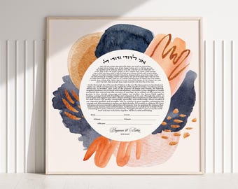 May include: A square ketubah featuring a central white circle with Hebrew and English text, surrounded by abstract watercolor shapes in navy blue, peach, and terracotta. The text includes lines for signatures, the names Benjamin and Esther, and the date 10.8.2026.