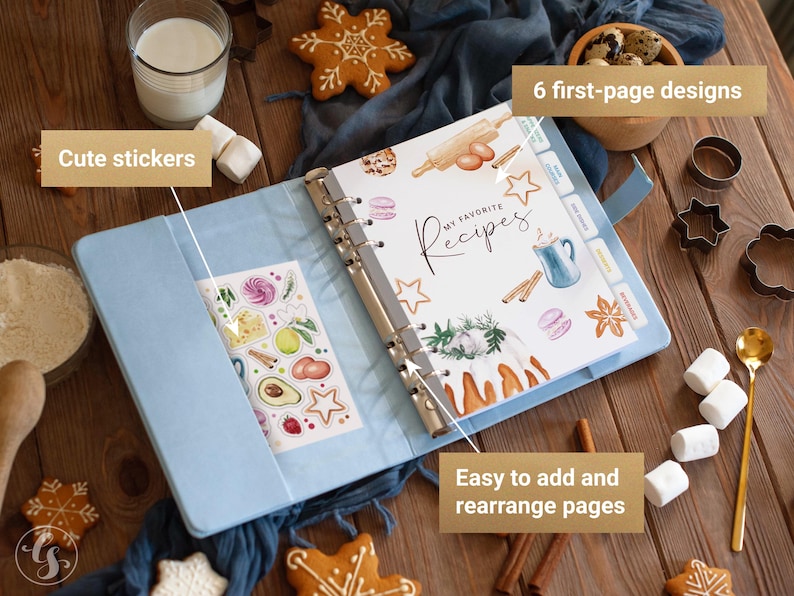 May include: A light blue ring-bound recipe binder featuring a cover page with the text "MY FAVORITE Recipes" and watercolor illustrations of baking ingredients. The binder includes a sheet of stickers and tabbed dividers for organization.