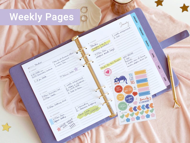 May include: A lavender six-ring binder planner open to a weekly schedule page with handwritten notes, a gold metal pen, and a sheet of colorful stickers featuring various shapes and phrases like You Got This and Smile It's Contagious.