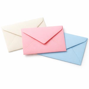 May include: Three rectangular paper envelopes arranged in a slight overlap. One envelope is cream-colored, one is light pink, and one is light blue. Each envelope features a classic triangular flap design and a smooth, matte paper texture.