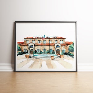 May include: Watercolor painting of a building with a red roof and a fountain in front. The building has a sign that says "Union Station".